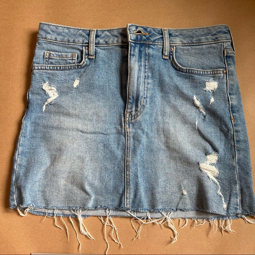 Distressed denim miniskirt